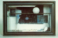 a black frame with an egg in it